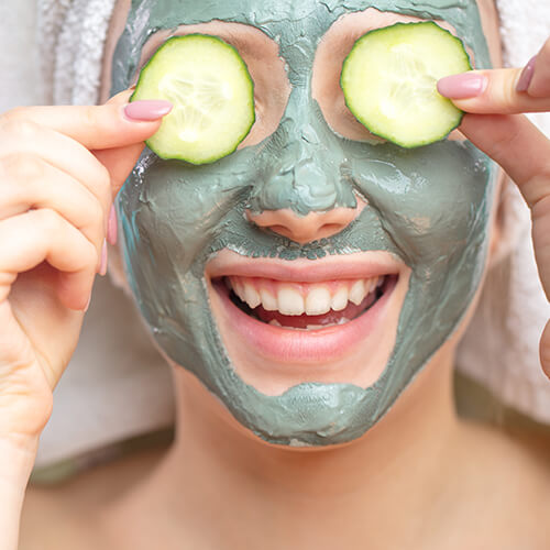 Woman with a DIY facial mask made at home