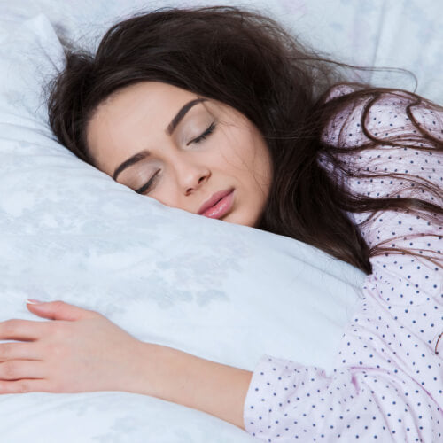 A woman sleeping in her makeup which is bad for your skin