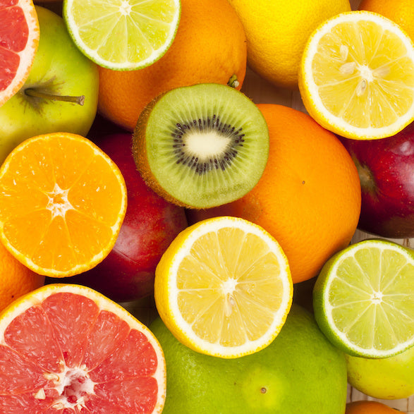 a photo of oranges and kiwis, food sources of skin-beneficial vitamin C