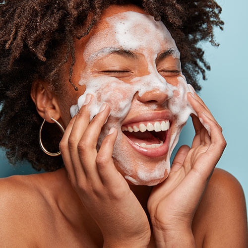 A woman getting a mental health boost from skincare