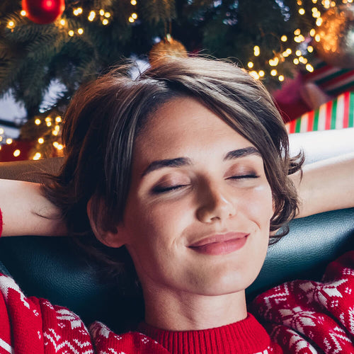 A woman online shopping for the holidays which can reduce stress