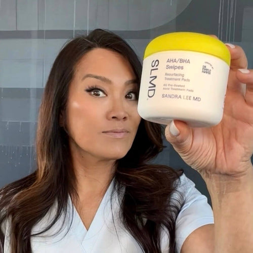 A photo of Dr. Pimple Popper with SLMD Skincare AHA/BHA Swipes for large pores and acne