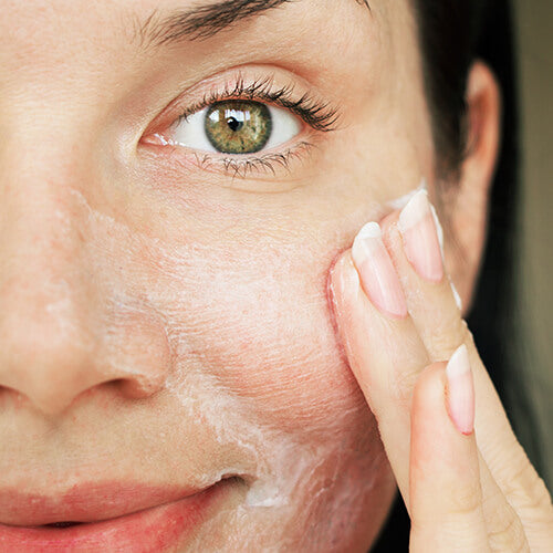 A woman using Skincare 101 SLMD Skincare