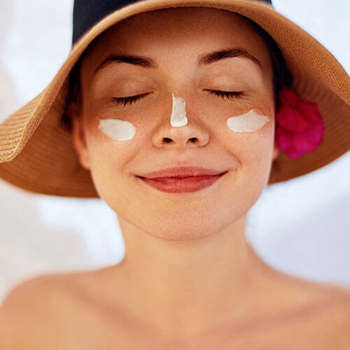 A woman wearing facial sunscreen