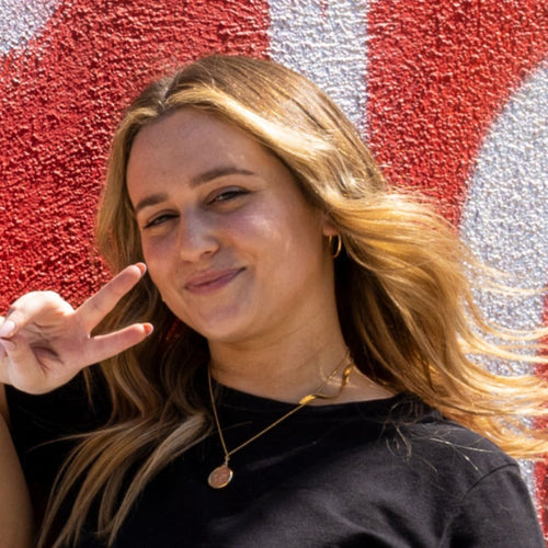 woman showing acne positivity promoted by SLMD Skincare